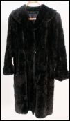 A vintage black fur full length coat,