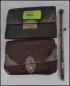 2 silver hallmarked embellished leather wallets together with an unusual silver rococo brush.