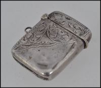 A silver hallmarked vesta case with rococo chases design.
