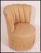 A retro 1950's fan back upholstered boudoir chair having ribbed back over circular seat with good