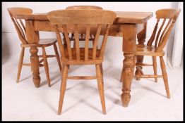 A good quality Victorian chunky pine kitchen dining table raised on turned legs with planked top
