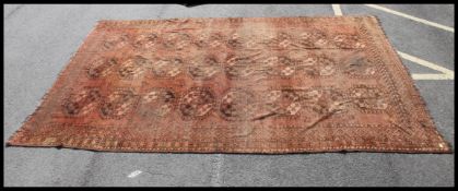 A large handwoven 20th century Turkish Kilim rug having red ground with central alternating