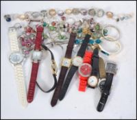 A collection of ladies and gents contemporary wrist watches along with a small collection of