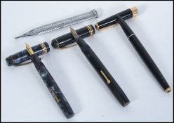 A collection of vintage fountain pens to include two Parker and a Conway Stewart with a 14k nib