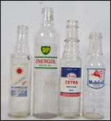 A collection of vintage mid century Industrial advertising automobilia glass oil bottles to include