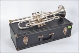 A cased 20th century American made chrome trumpet by Dynasty model No E5877 complete with mouth