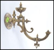 A Victorian / Edwardian early 20th century wall mountable metal spirit lamp bracket of unusual form.