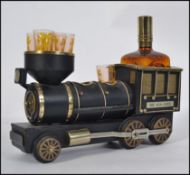 A retro vintage 1970's drinks / liqueur set in the form of a train being musical having decanter