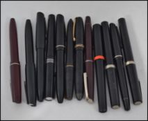 A collection of old 20th century / mid century fountain pens by Osmirod to include black cases,
