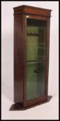 An early 20th century oak cased gun cabinet,