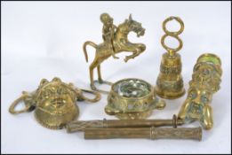 A collection of mid 20th century Indonesian / Asian brass deitys and other metalwares to include