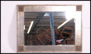 A large contemporary bevelled edge wall mirror,