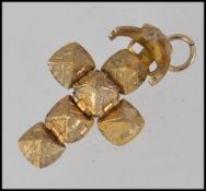 A 9ct gold Masonic puzzle ball cross pendant. Hallmarked Birmingham by maker DJ & Co. Weight 3.7g .
