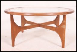 A retro 1970's atomic style circular coffee table of Danish influence.