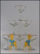 A collection of 6 Babycham glasses having yellow fawns together with 2 plastic Babycham fawn