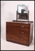An Air Ministry style oak chest of drawers raised on inset plinth base with a central wide bank of