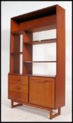 A vintage mid century teak room divider sideboard having 3 drawers to eft with drop cupboards to