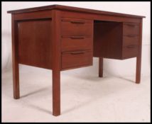 A retro 1970's teak wood Danish influence desk.