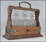 A stunning Victorian miniature walnut and cut glass 3 piece tantalus / decanter set.