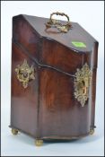 A George III 19th century mahogany knife box, the sloping top and sides with stunning brass works,