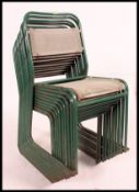 A set of ten mid century green painted tubular steel framed stacking chairs with canvas seats and