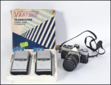 A vintage Olympus 35mm camera along with a boxed pair of retro vantone recievers
