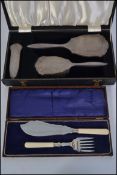 A silver hallmarked cased dressing table set,