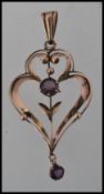 A 9ct gold and amethyst set Victorian Art Nouveau necklace pendant.