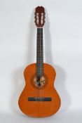 A 20th century Spanish acoustic guitar complete in the carry caser