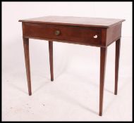 A 19th century Georgian mahogany writing table - side table being raised on squared legs with