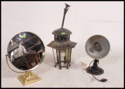 A retro heat lamp ideal as a conversion to a lamp together with a round brass 1970's dressing