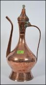 A tall early 20th century middle eastern copper metalware coffee pot, probably Turkish,