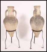A good pair of stone amphora vases - garden ornaments with twin handles to the waisted necks