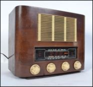 A retro 1950's Strad radiogram set in wooden case with decorative facia