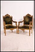 A pair of 19th century French gilded fauteuil / armchairs The gilt framed chairs being raised on
