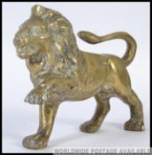 A 20th century cast brass figural Lion figure,