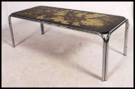 A 1970's chrome retro / vintage coffee table being raised on tubular chrome supports having inset
