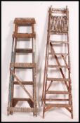 2 vintage 20th century Industrial wooden step ladders - ideal as conversion to bookshelves.