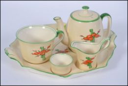 A 1930's Art Deco hand painted tea set by Royal Winton 'Ivory '. Comprising tray, teapot.