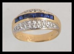 A 9ct gold pave set blue sapphire garnet and diamond ring approx 20pnts. Size M.5 / Weight 3.