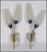 A pair of retro mid century wall lights,