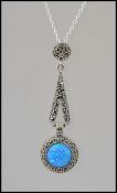 A silver and marcasite opal pendant necklace and silver chain.