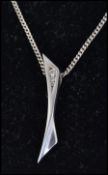A Danish silver 925 contemporary ladies pendant in the manner of Georg Jensen set to a kerb link