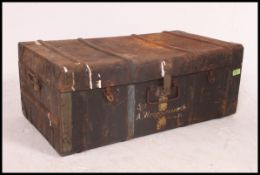 A black painted military tin trunk with notation to the top for Sgt A Wigglesworth,