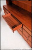A large 1970's retro McIntosh teak upright wall unit sideboard.