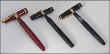 A collection of 3 vintage fountain pens to include Parker 14ct nib in maroon,