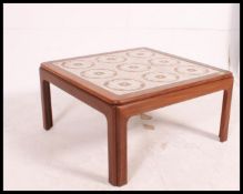 A retro teak made tile top square coffee table.