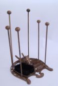 A decorative horse equestrian themed boot scraper and holder piece.