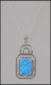 A ladies silver cz and blue opalite pendant necklace and silver chain.