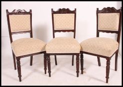 A set of four over stuffed Victorian dining chairs,